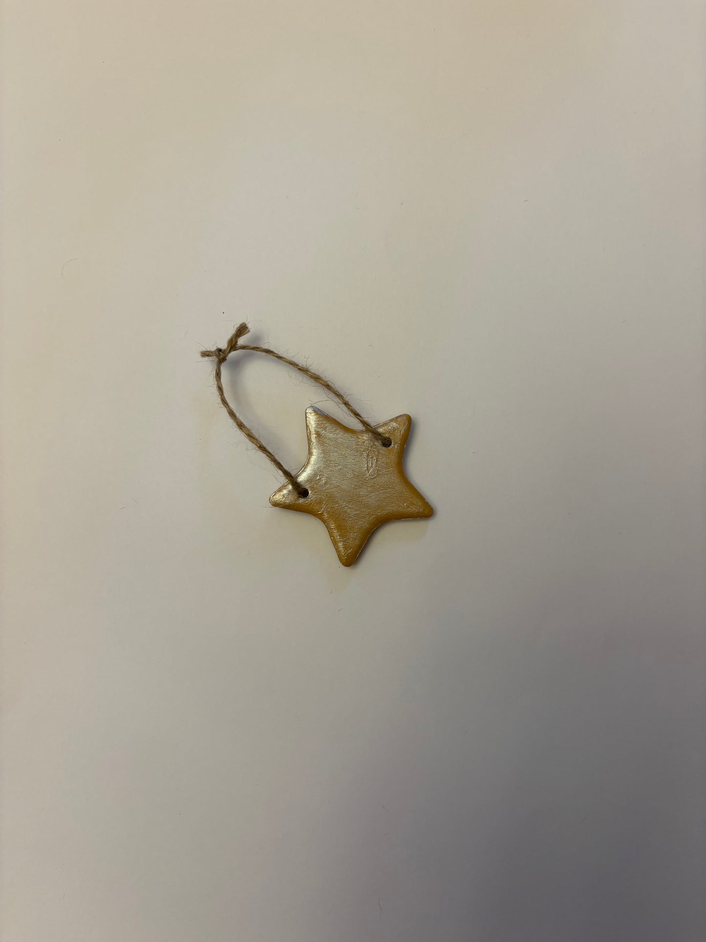 Gold ceramic star bauble