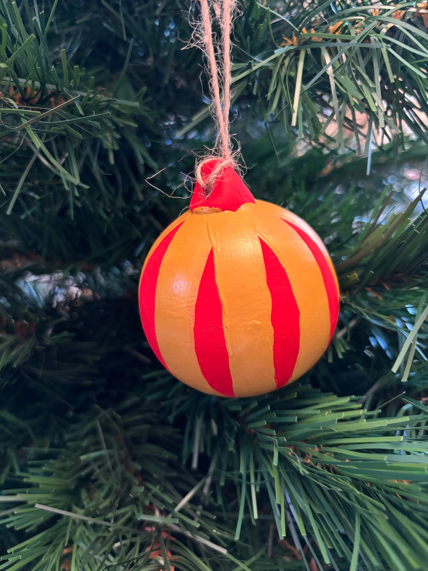 Red and gold striped bauble