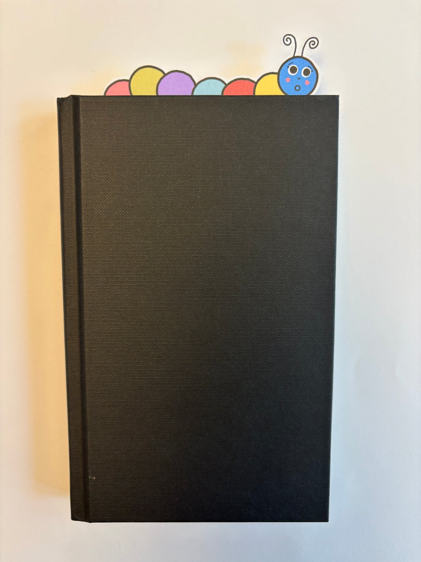 Multicoloured caterpillar bookmark